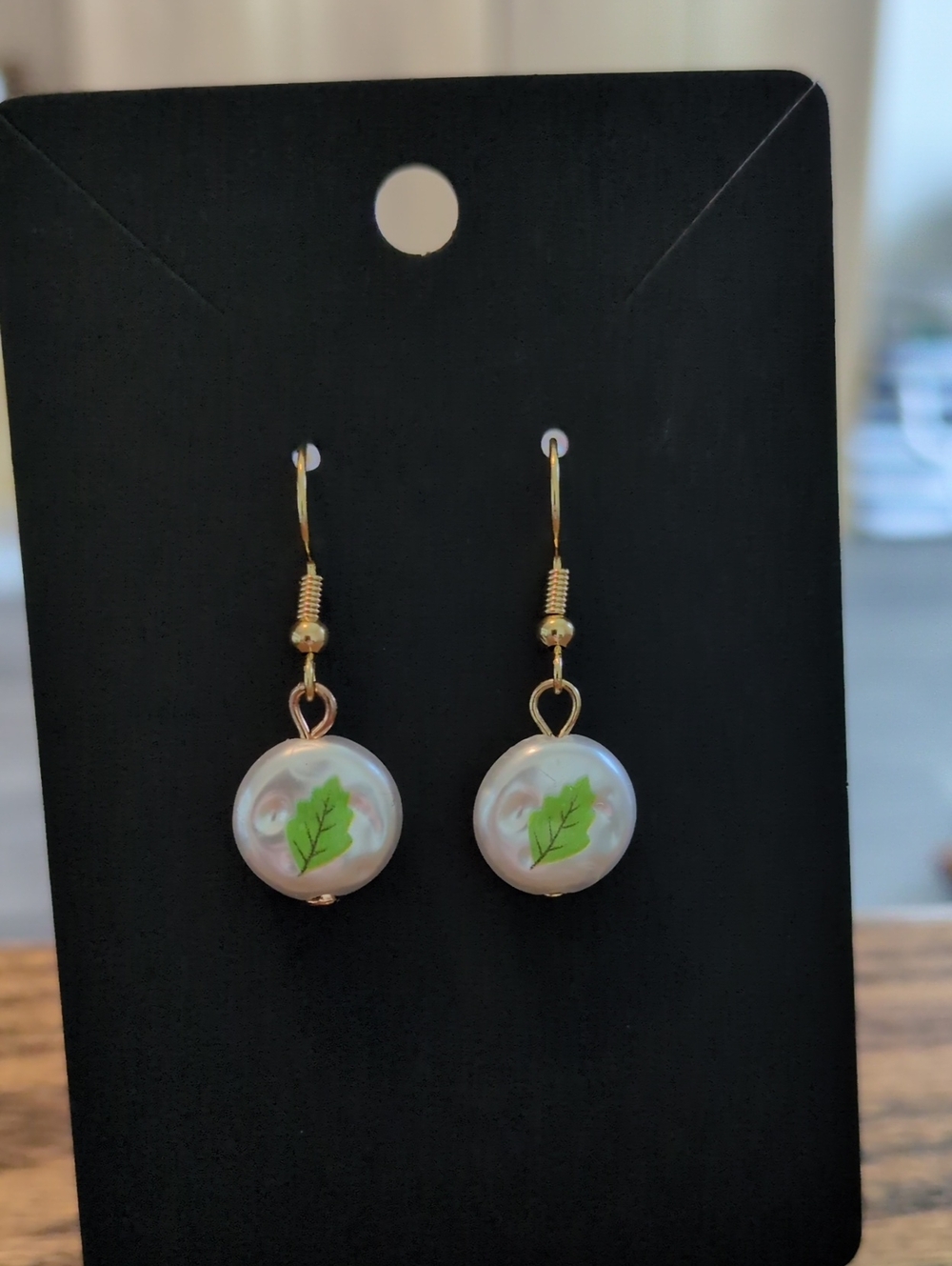 Gold Pearl Drop Earrings with Green Leaf Accent